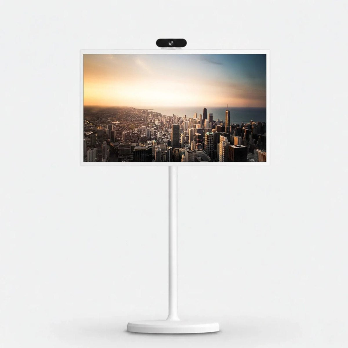 TV HOME with a city skyline at sunset on screen